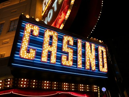A yellow casino sign with blue lights