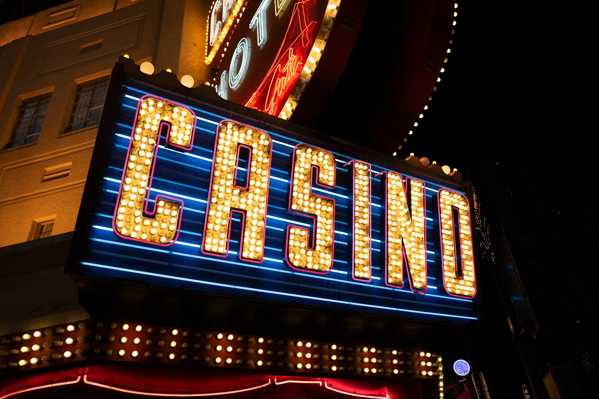Mobile Casino Trends Sweeping Across East Asia_large | SistersSites.co.uk A yellow casino sign with blue lights